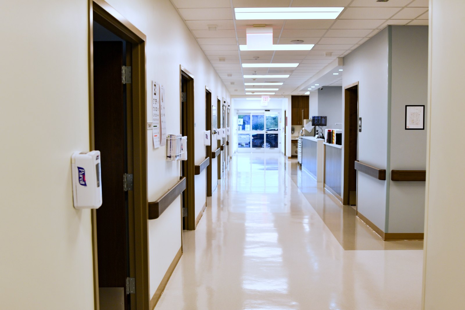 The treatment corridor at El Mirage ER — patient rooms along one side and the nurses' station along the other.